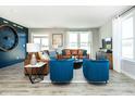 Beautifully staged living room with hardwood floors, stylish furniture, and ample natural light at 268 Onset Way, Westfield, IN 46074