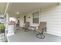 Relaxing front porch with comfortable seating, perfect for enjoying the outdoors at 2709 S Mcclure St, Indianapolis, IN 46241