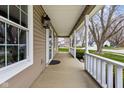 Inviting covered front porch featuring classic columns, neutral siding, and a glimpse of the neighborhood at 464 Hyannis Dr, Avon, IN 46123