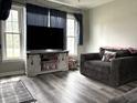 Bright living room with large windows and comfortable seating at 5368 Southeastern Ave, Indianapolis, IN 46203