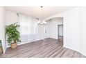 Bright dining area featuring hardwood floors, modern light fixture, and natural light at 5761 Handbell Ln, Greenwood, IN 46143