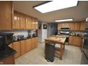 Spacious kitchen with stainless steel appliances, a large island and butcher block countertop at 5819 Bar Del E Dr, Indianapolis, IN 46221