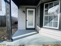 Inviting front porch with freshly painted pillars and new door at 6640 Manassas Dr, Indianapolis, IN 46241