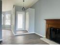 Bright living room with stylish laminate flooring and classic fireplace at 6640 Manassas Dr, Indianapolis, IN 46241