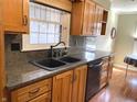 Close up of the spacious kitchen sink and updated stainless steel dishwasher at 1054 Carters Grove, Indianapolis, IN 46260