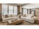 Bright living room featuring two sofas, large windows and natural light at 12889 Copper Run Blvd, Carmel, IN 46074
