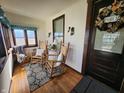 Cozy sunroom with rocking chairs, a decorative rug, and ample natural light from windows at 611 W South St, Shelbyville, IN 46176