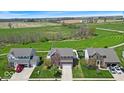 Beautiful aerial view of a well manicured property in a rural neighborhood at 6862 School Branch Dr, Brownsburg, IN 46112