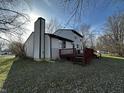 This home offers a nice backyard with a deck, perfect for outdoor gatherings and enjoying the natural surroundings at 8054 Harvest Ln, Indianapolis, IN 46256