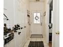 Inviting foyer with a white door and ceramic tile flooring at 15524 Dusty Trl, Noblesville, IN 46060