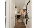 Hallway view featuring hardwood floors that transition into an open living space at 15524 Dusty Trl, Noblesville, IN 46060