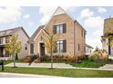 Attractive brick home featuring professional landscaping, a stone retaining wall, and a welcoming entrance at 15628 Allegro Dr, Westfield, IN 46074