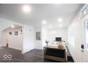 Bright living room with neutral paint, hardwood floors, and ample natural light at 1715 Fletcher Ave, Indianapolis, IN 46203