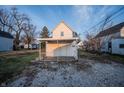 Exterior view of the back of a home showcasing a covered porch at 2639 Central Ave, Anderson, IN 46016