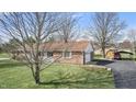 Spacious backyard featuring a detached garage and covered parking spot with well-maintained landscaping around property at 298 Northridge Dr, Mooresville, IN 46158