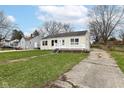 A single story home featuring a cozy front porch and inviting curb appeal at 315 S Parkway Dr, Anderson, IN 46013