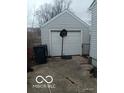 Detached single car garage in the backyard of the house with basketball hoop at 3907 Haverhill Dr, Anderson, IN 46013