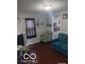 Cozy living room with comfortable seating and view of the kitchen at 3907 Haverhill Dr, Anderson, IN 46013