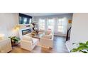 Cozy living area with modern fireplace, large windows and cat tree at 4271 Barrel Ln, Westfield, IN 46062
