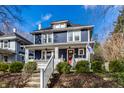 Inviting two-story home with a cozy front porch, perfect for enjoying the outdoors at 4350 N College Ave, Indianapolis, IN 46205