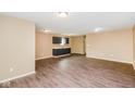Bright open floorplan features hardwood floors and view of cabinets and sink at 5010 Elliott Ave, Indianapolis, IN 46201