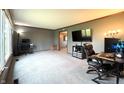 Spacious living room with neutral carpet and a large window for natural light at 5967 Oak Hill East Dr, Plainfield, IN 46168