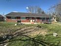 Backyard featuring a garden, trampoline, and grill, perfect for outdoor entertaining at 731 W Stop 11 Rd, Indianapolis, IN 46217