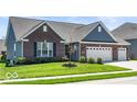 Lovely single-Gathering home with manicured lawn and attached three-car garage at 7447 Starkey Ct, Indianapolis, IN 46278