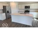 Modern kitchen featuring stainless steel appliances, granite countertops, and a center island at 7549 Big Bend Blvd, Camby, IN 46113
