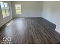 Open-concept living room featuring hardwood floors, recessed lighting, and natural light at 7549 Big Bend Blvd, Camby, IN 46113