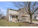 Charming home with a two-car garage, complemented by flower beds and a well-manicured lawn at 8926 Poppy Ln, Indianapolis, IN 46231