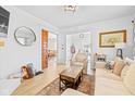 Comfortable living room with hardwood floors, stylish decor, and an open doorway to dining area at 935 N Tacoma Ave, Indianapolis, IN 46201