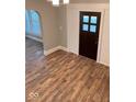 Beautiful living room featuring new floors and an archway, creating an inviting space at 950 N Rural St, Indianapolis, IN 46201