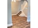 Stylish staircase with hardwood flooring and white banister, blending elegance and functionality at 950 N Rural St, Indianapolis, IN 46201