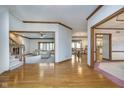 Spacious open-concept living room and dining room with hardwood floors and lots of natural light at 1143 N Sugar Bend Run, Greenfield, IN 46140