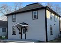 Attractive two-story home with updated siding and a welcoming front porch, perfect for families at 1809 S H St, Elwood, IN 46036