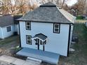 Charming two-story home boasts updated siding and a modern roof, set in a quiet neighborhood at 1809 S H St, Elwood, IN 46036