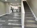 Spacious living area flows into the modern kitchen, with sleek flooring and bright natural light at 1809 S H St, Elwood, IN 46036