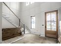 Bright foyer with decorative trim, staircase, and natural wood front door provides a grand entrance at 19909 Windsor Park Blvd, Westfield, IN 46069