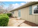 Close up of a house with a light blue front door and matching window shutters at 2072 S Rembrandt Cv, Martinsville, IN 46151