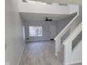 Bright and airy living room with a staircase, fresh paint, and plenty of natural light at 2249 Grand Fir Dr, Greenwood, IN 46143