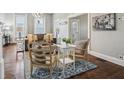 Cozy living room with hardwood floors, a stylish rug, and neutral decor at 234 S State Ave, Indianapolis, IN 46201
