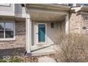 Covered front porch featuring brick columns, a blue front door, and space for welcoming decor at 2916 Scottsdale Dr, Indianapolis, IN 46234