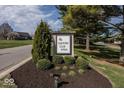 Community entrance sign with 'Country Club Pines' inscription, complemented by lush landscaping at 2916 Scottsdale Dr, Indianapolis, IN 46234