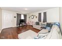 Comfortable living room features hardwood floors and neutral tones at 4414 Lexington Ave, Indianapolis, IN 46203