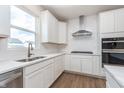 Bright kitchen features stainless appliances, white cabinets and subway tile backsplash at 5314 Noble Crossing W Pkwy, Noblesville, IN 46062