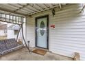 Cozy front porch with a porch swing, leading to the front door with an oval glass insert at 5902 Sunset Dr, Indianapolis, IN 46239