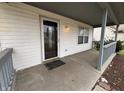 Covered front porch with gray railings and space for seating adds curb appeal to the home at 7130 English Birch Ln, Indianapolis, IN 46268