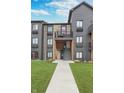 Apartment building exterior shows stone facade, stairways and a walkway surrounded by green grass at 102 Clarendon Dr # 514, Noblesville, IN 46062