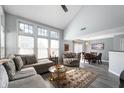 Bright living room with soaring ceilings, large windows, and stylish furniture and décor at 1568 Brookfield Cir, Franklin, IN 46131